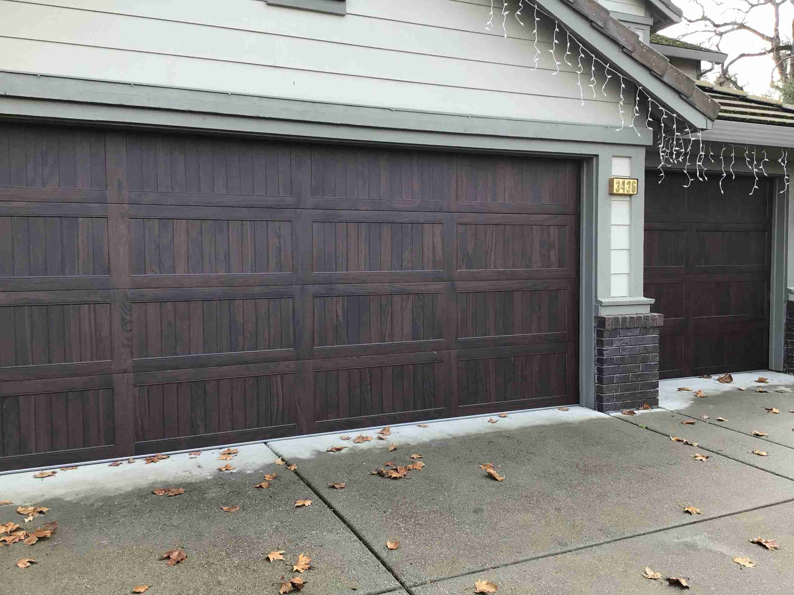 CHS LP, Walnut CHI Overhead Garage Door Model 5950 With Woodtone Accent Color