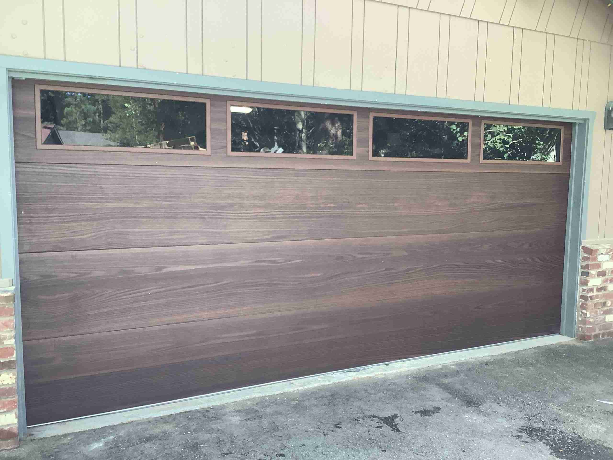 Flush Panel, Dark Oak CHI Overhead Garage Door Woodtone Accent Color