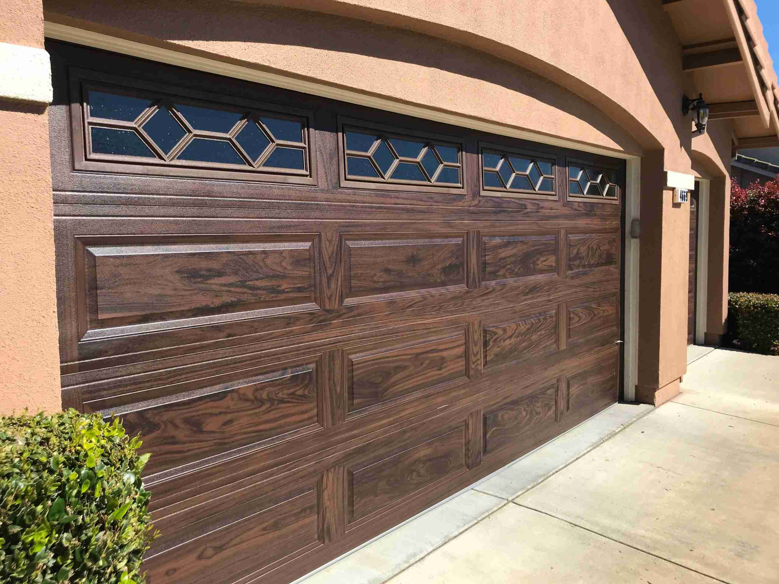 adbc2e846f67715a46e86039a504faa5 CHI Long Panel Garage Door With Woodtone Accent Color